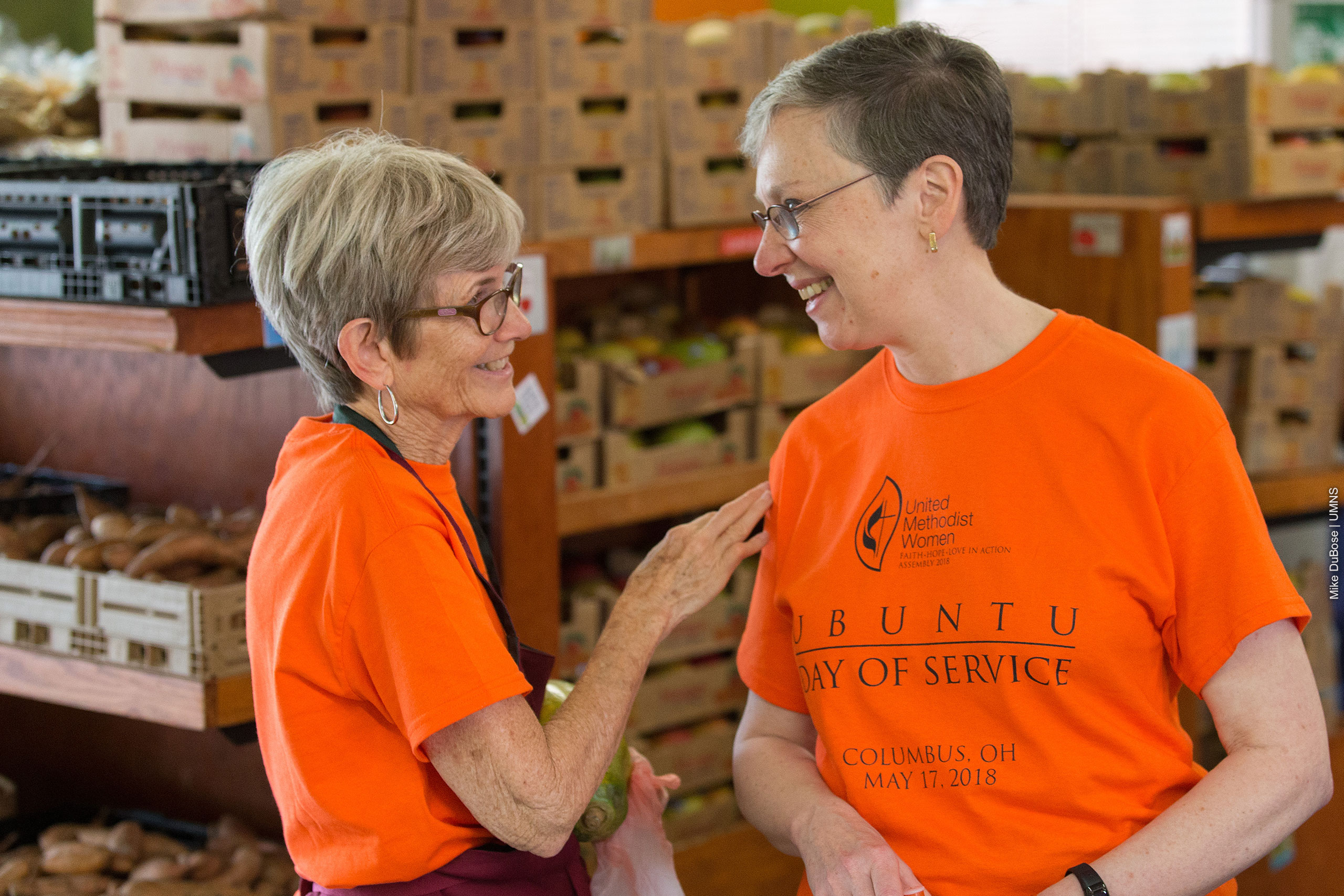 Barbie Schmenner visits with Harriett Jane Olson as part of the Ubuntu Day of Service during the United Methodist Women Assembly 2018 in Columbus, Ohio.