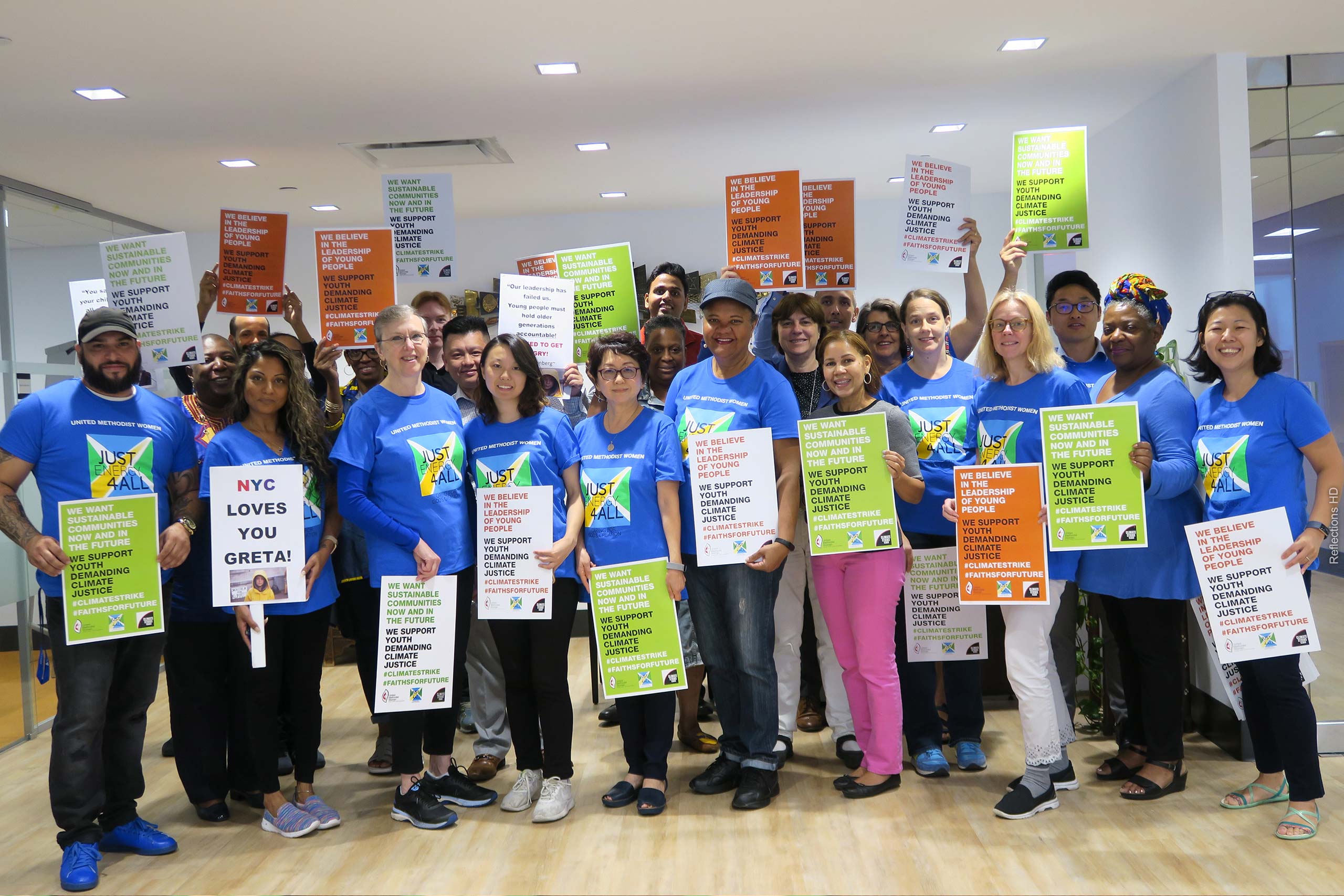 Group photo of United Women in Faith staff in the national office preparing for climate march
