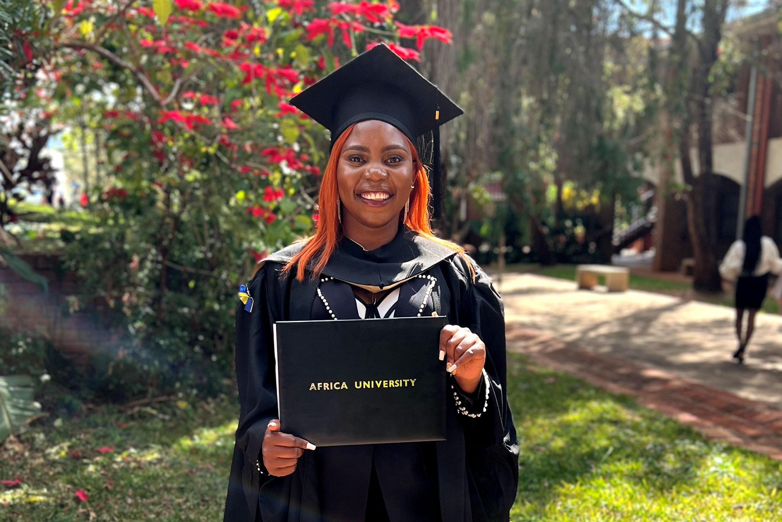 Student holds her diploma